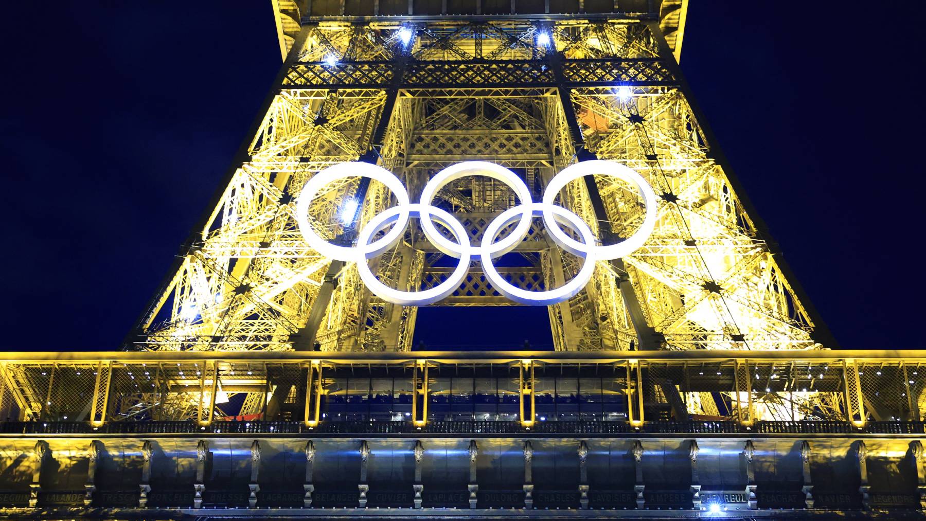 The Olympic rings mounted on the Eiffel Tower is illuminated in Paris on June 28, 2024. The Summer Games will kick off from July 26 to August 11 in France's capital and the iconic monument was decorated with a recycled steel display of the Olympic iconic five-ring logo.( The Yomiuri Shimbun )