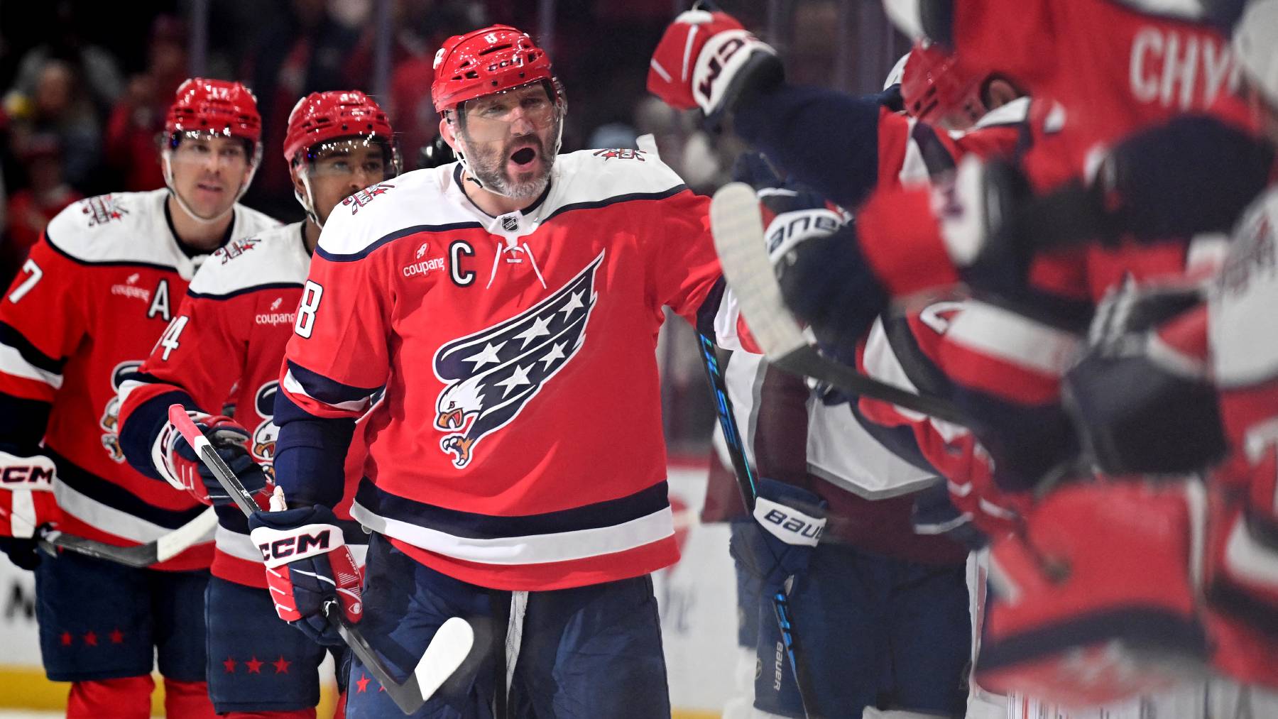 WASHINGTON, DC - MARCH 22: Alex Ovechkin #8 of the Washington Capitals celebrates with teammates after scoring in the third period against the Colorado Avalanche at Capital One Arena on March 22, 2026 in Washington, DC. The goal was Ovechkin's 923rd regular season goal and 1000th career goal including the regular season and playoffs. Greg Fiume/Getty Images/AFP