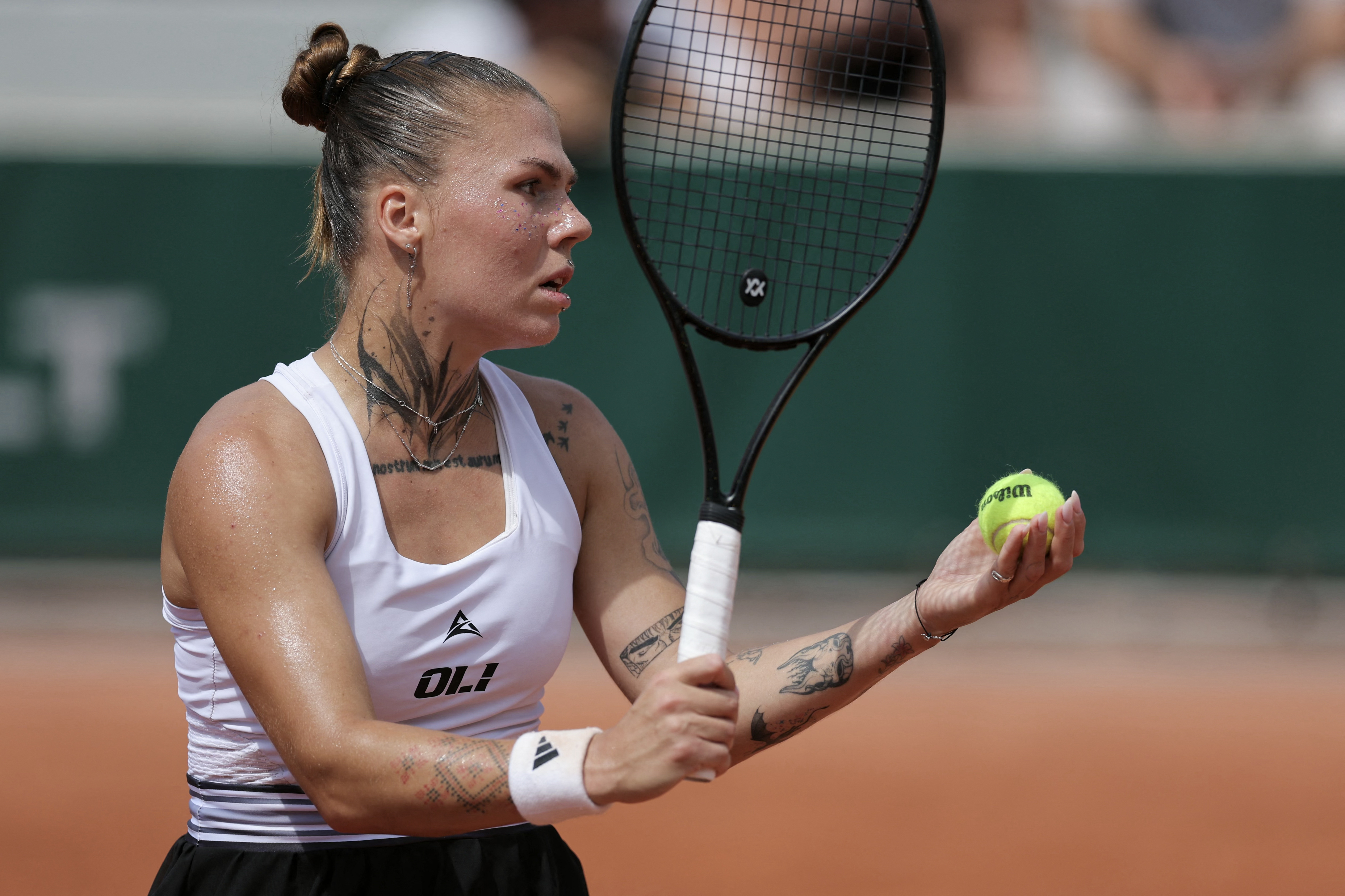 Ukraine's Oleksandra Oliynykova prepares to serve to Diana Shnaider during their women's singles match on day 7 of the French Open tennis tournament at the Roland-Garros Complex in Paris on May 30, 2026.