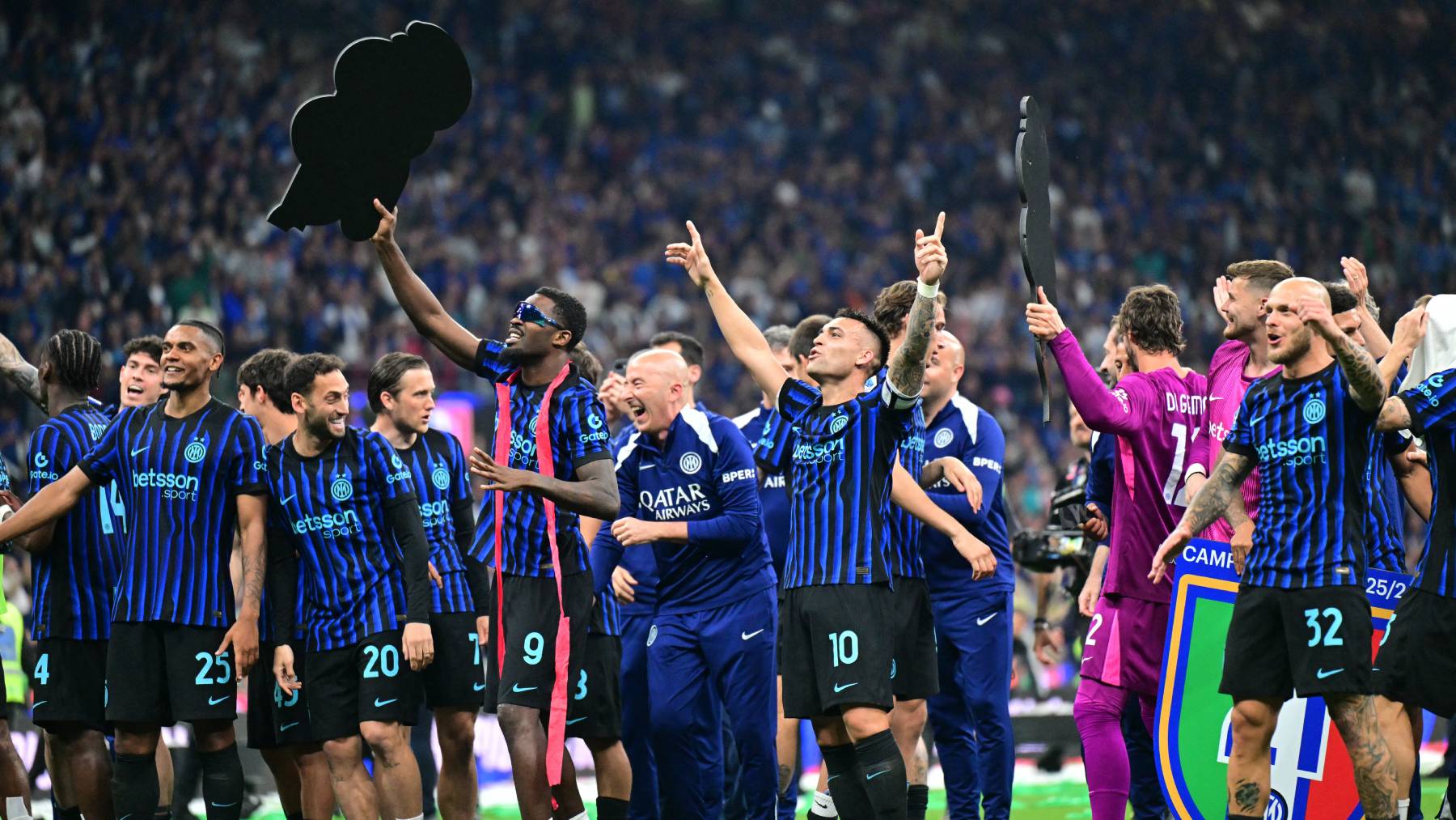Inter Milan's French forward #9 Marcus Thuram and Inter Milan's Argentinian forward #10 Lautaro Martinez celebrate with teammates after winning the 21st 'scudetto' following the Italian Serie A football match between Inter Milan and Parma at San Siro stadium in Milan, on May 3, 2026.