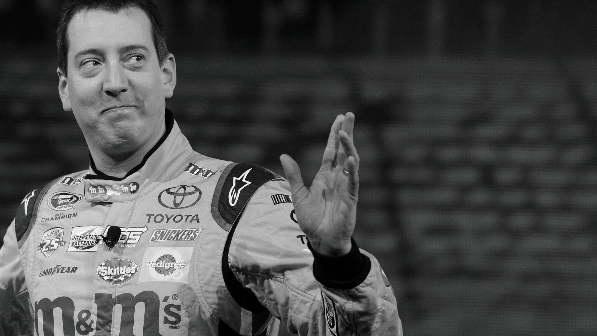 (FILES) 2015 NASCAR Sprint Cup Series Champion Kyle Busch waves as he arrives at the Toyota press conference during the 2017 North American International Auto Show in Detroit, Michigan, on January 9, 2017. NASCAR star Kyle Busch, a two-time Cup series champion regarded as one of the sport's greatest ever drivers, died May 21, 2026 aged 41, his family confirmed in a joint statement. He was in his 22nd season in NASCAR's top division and had been hospitalized earlier Thursday with an undisclosed but "severe illness".