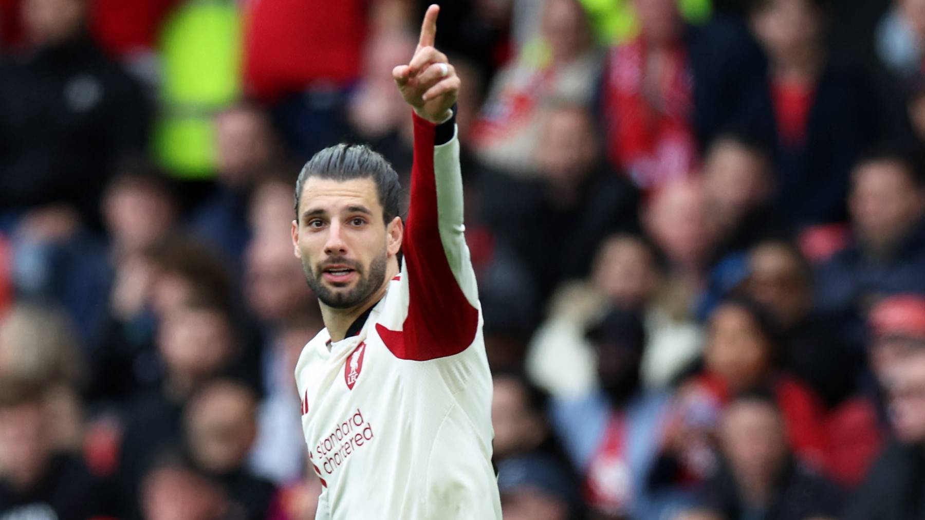 Liverpool's Hungarian midfielder #08 Dominik Szoboszlai celebrates scoring the team's first goal during the English Premier League football match between Manchester United and Liverpool at Old Trafford in Manchester, north west England, on May 3, 2026.