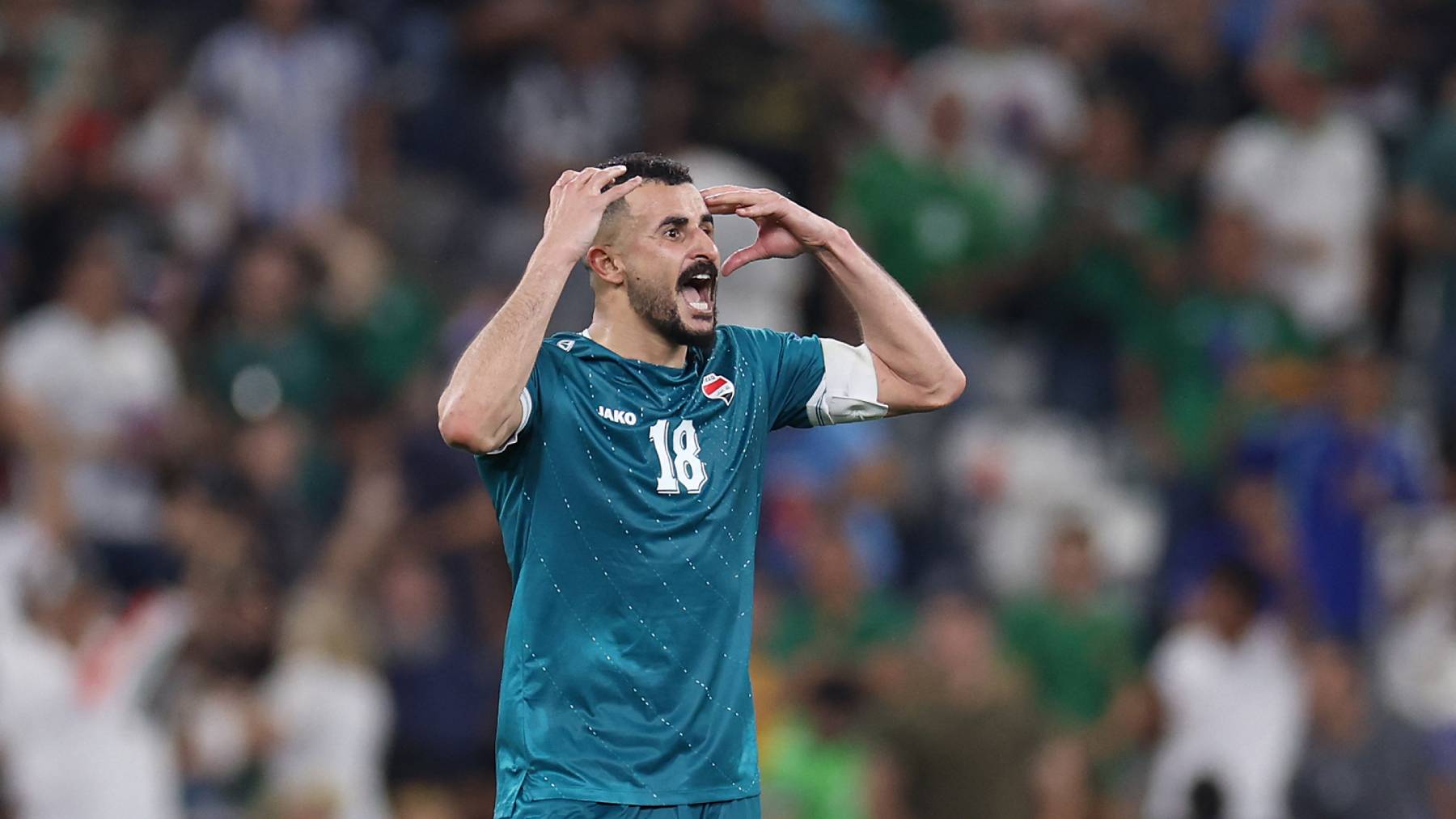 Iraq's forward #18 Aymen Hussein celebrates scoring his team's second goal during the 2026 FIFA World Cup qualifiers final playoff football match between Iraq and Bolivia at the BBVA Stadium in Guadalupe, Nuevo Leon state, Mexico, on March 31, 2026.