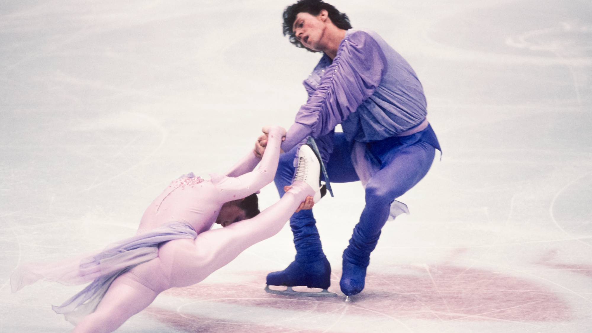 ALBERTVILLE, FRANCE - FEBRUARY 11: Natalia Michkouteniok and Artour Dmitriev of the Unified Team compete in the Pairs Free Skate event in the Figure Skating competition of the 1992 Winter Olympic Games on February 11, 1992 in the Olympic Hall in Albertville, France; they were the gold medalists in the event. (Photo by David Madison/Getty Images)