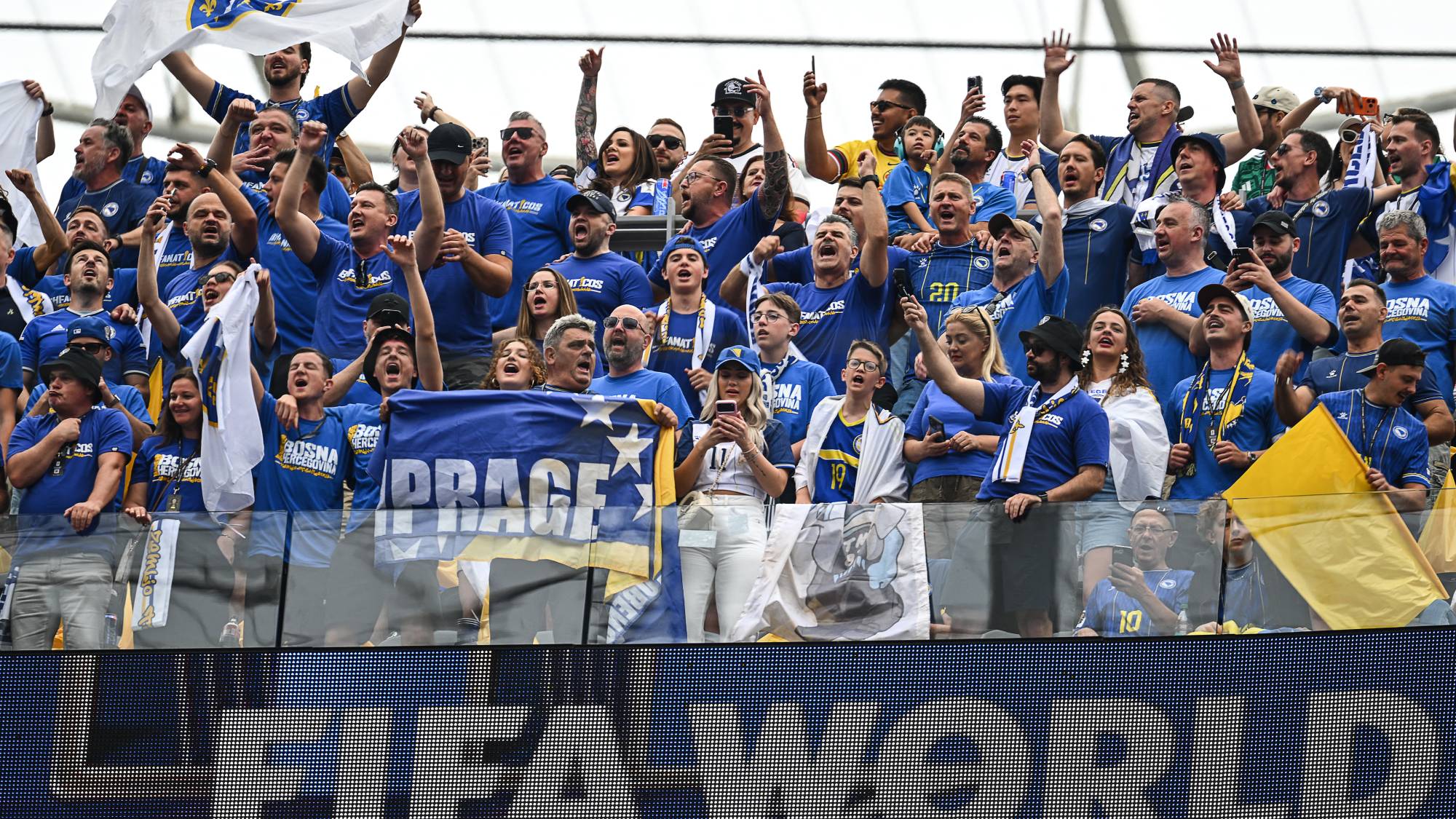 Bosnian fans cheer for their team ahead of the 2026 World Cup Group B football match between Switzerland and Bosnia and Herzegovina at Los Angeles Stadium in Inglewood on June 18, 2026.