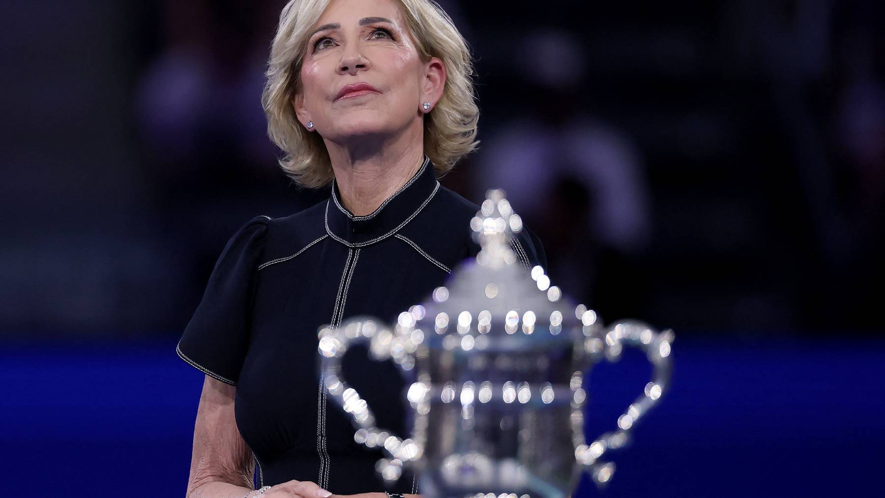 NEW YORK, NEW YORK - SEPTEMBER 06: Former US Open champion Chris Evert stands near the Women's Championship trophy during the ceremony after the Women's Singles Final match at USTA Billie Jean King National Tennis Center on September 06, 2025 in the Flushing neighborhood of the Queens borough of New York City. Elsa/Getty Images/AFP
