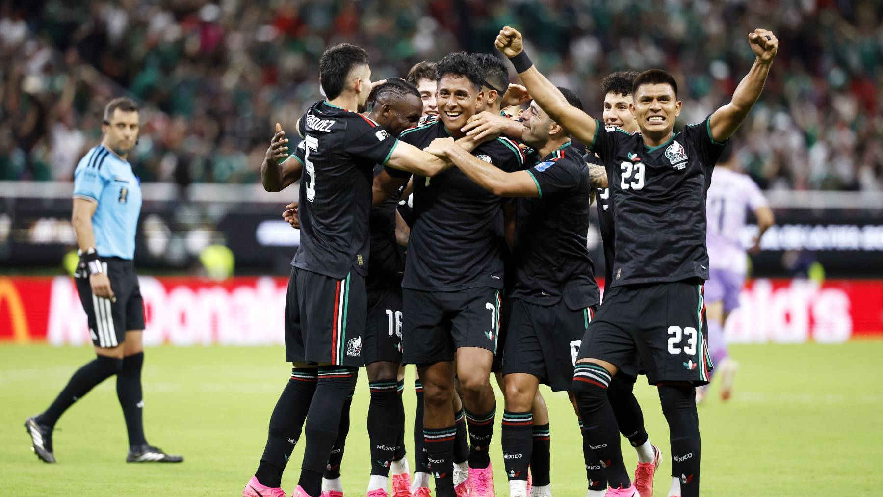 Mexico's midfielder #07 Luis Romo celebrates with teammates scoring his team's first goal during the 2026 World Cup Group A football match between Mexico and South Korea at the Guadalajara Stadium in Zapopan on June 18, 2026.