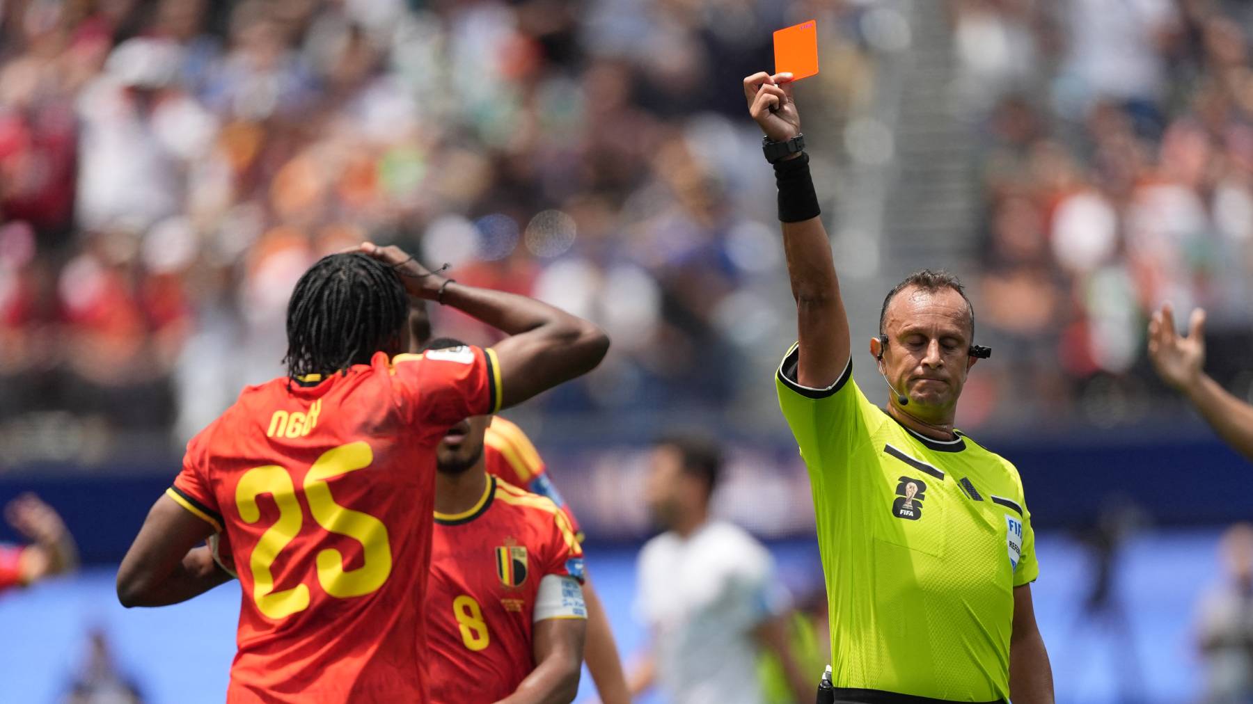 LOS ANGELES, CALIFORNIA - JUNE 21: Referee Dari­o Herrera shows red card to Nathan Ngoy of Belgium during the 2026 FIFA World Cup First Stage Group G match between IR Iran and Belgium at the Los Angeles Stadium (SoFi Stadium) in Inglewood, California, United States on June 21, 2026. Tayfun Coskun / Anadolu