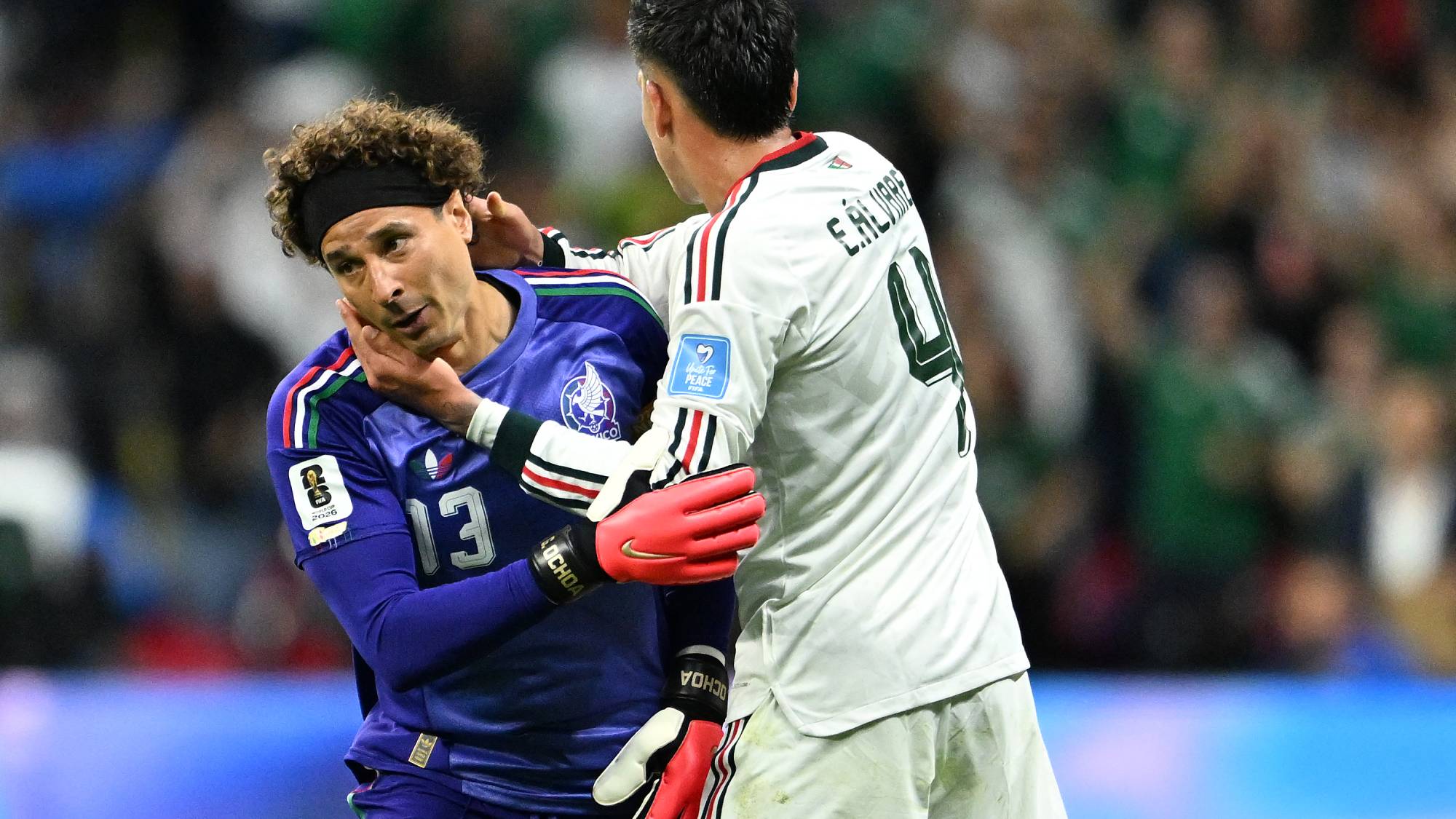Mexico's goalkeeper #13 Guillermo Ochoa hugs teammate midfielder #04 Edson Alvarez as he is substituted in during the 2026 World Cup Group A football match between the Czech Republic and Mexico at the Mexico City Stadium in Mexico City on June 24, 2026.