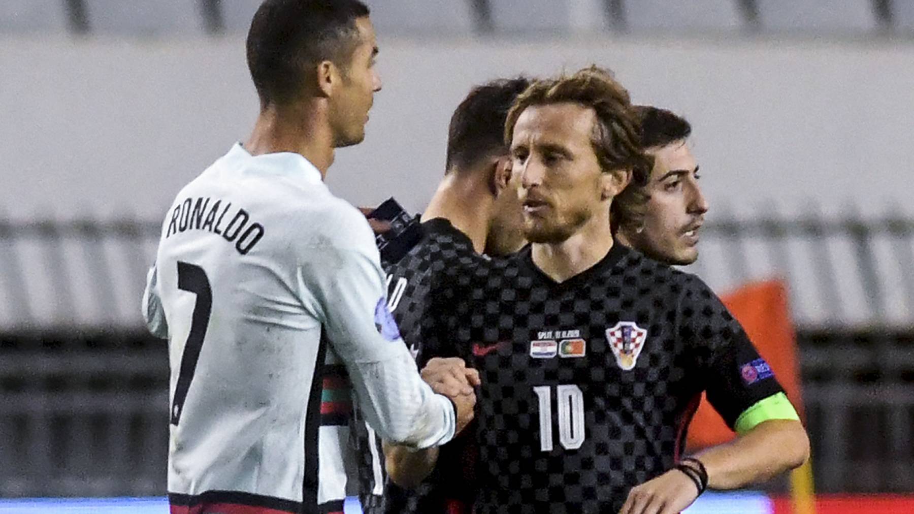 Portugal's midfielder Cristiano Ronaldo (L) greets Croatia's midfielder Luka Modric at the end of the UEFA Nations League A Group 3 football match between Croatia and Portugal at the Poljud Stadium in Split, on November 17, 2020.