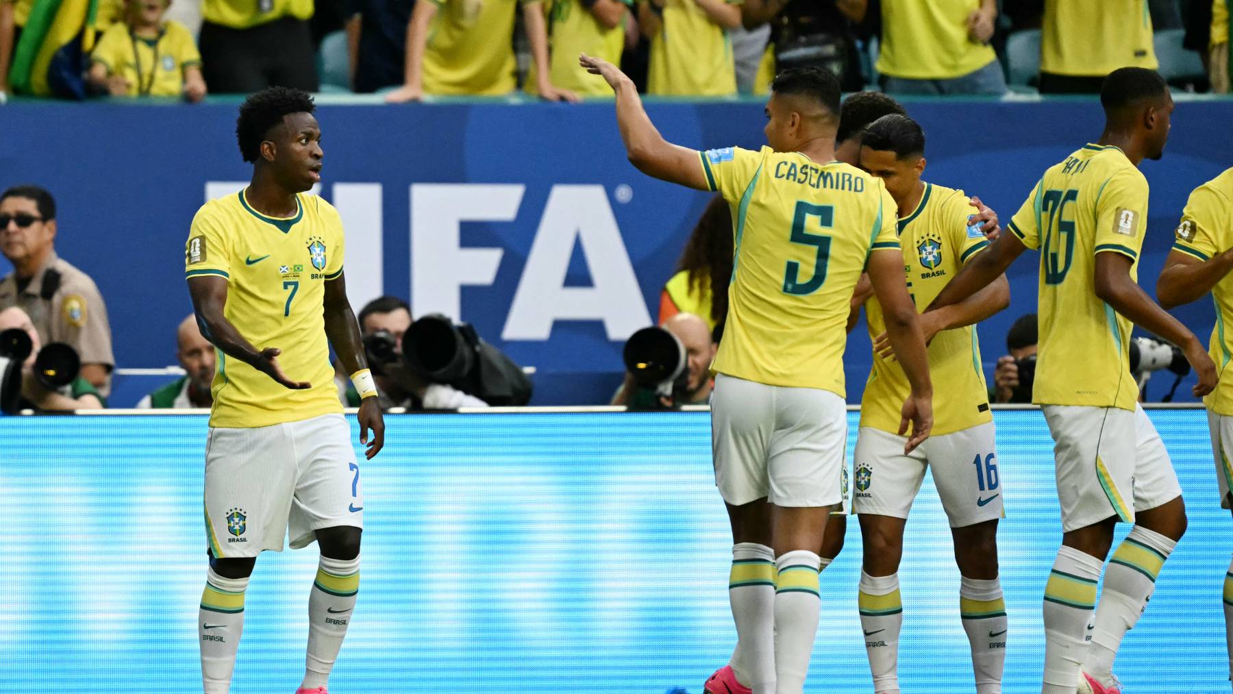 Brazil's forward #07 Vinicius Junior celebrates with teammates after scoring his team's first goal during the 2026 World Cup Group C football match between Scotland and Brazil at the Miami Stadium in Miami Gardens on June 24, 2026.
