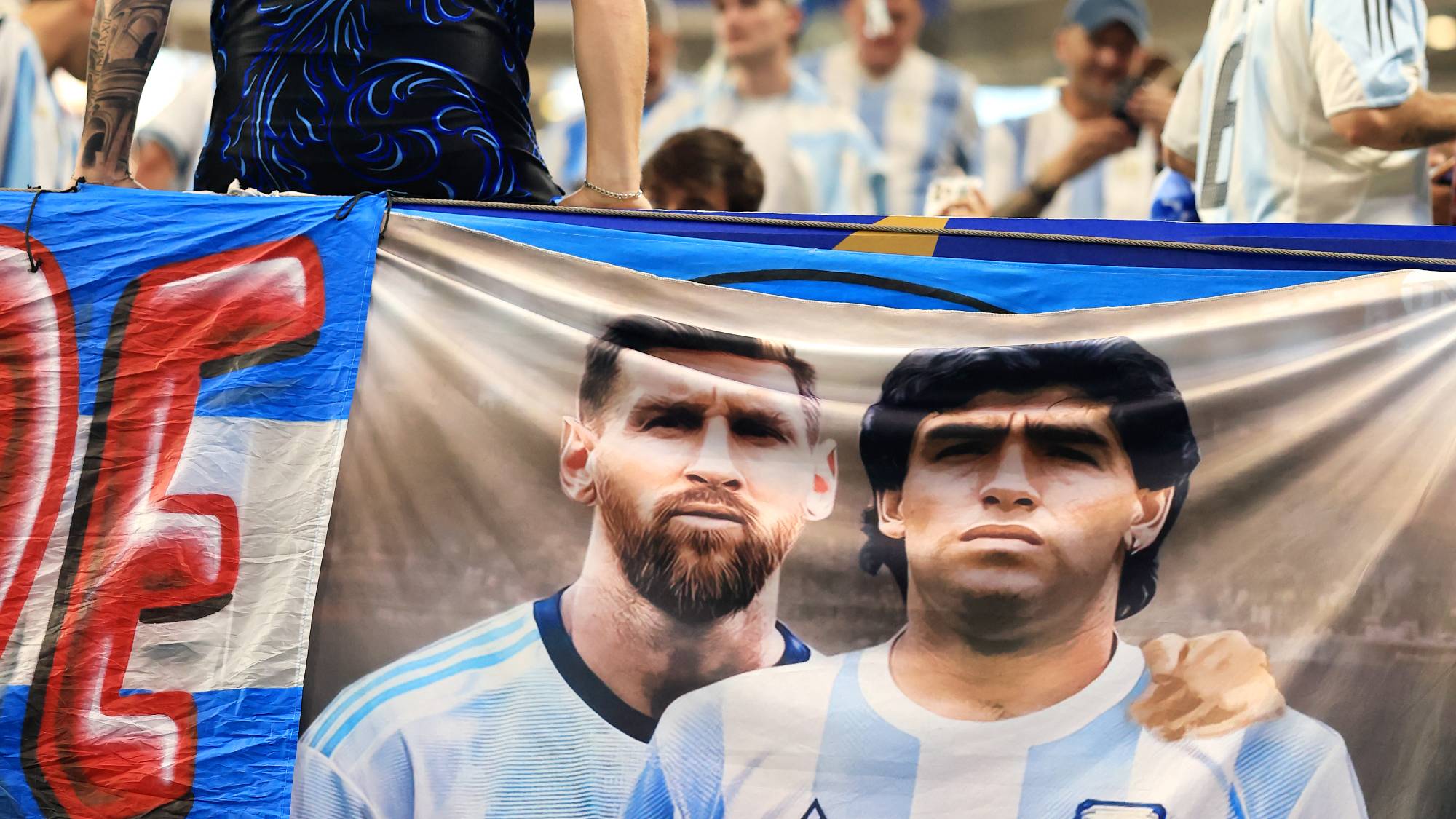 ATLANTA, GEORGIA - JULY 07: A banner featuring Lionel Messi and Diego Maradona of Argentina is seen before the FIFA World Cup 2026 Round of 16 match between Argentina and Egypt at Atlanta Stadium on July 07, 2026 in Atlanta, Georgia. Elsa/Getty Images/AFP