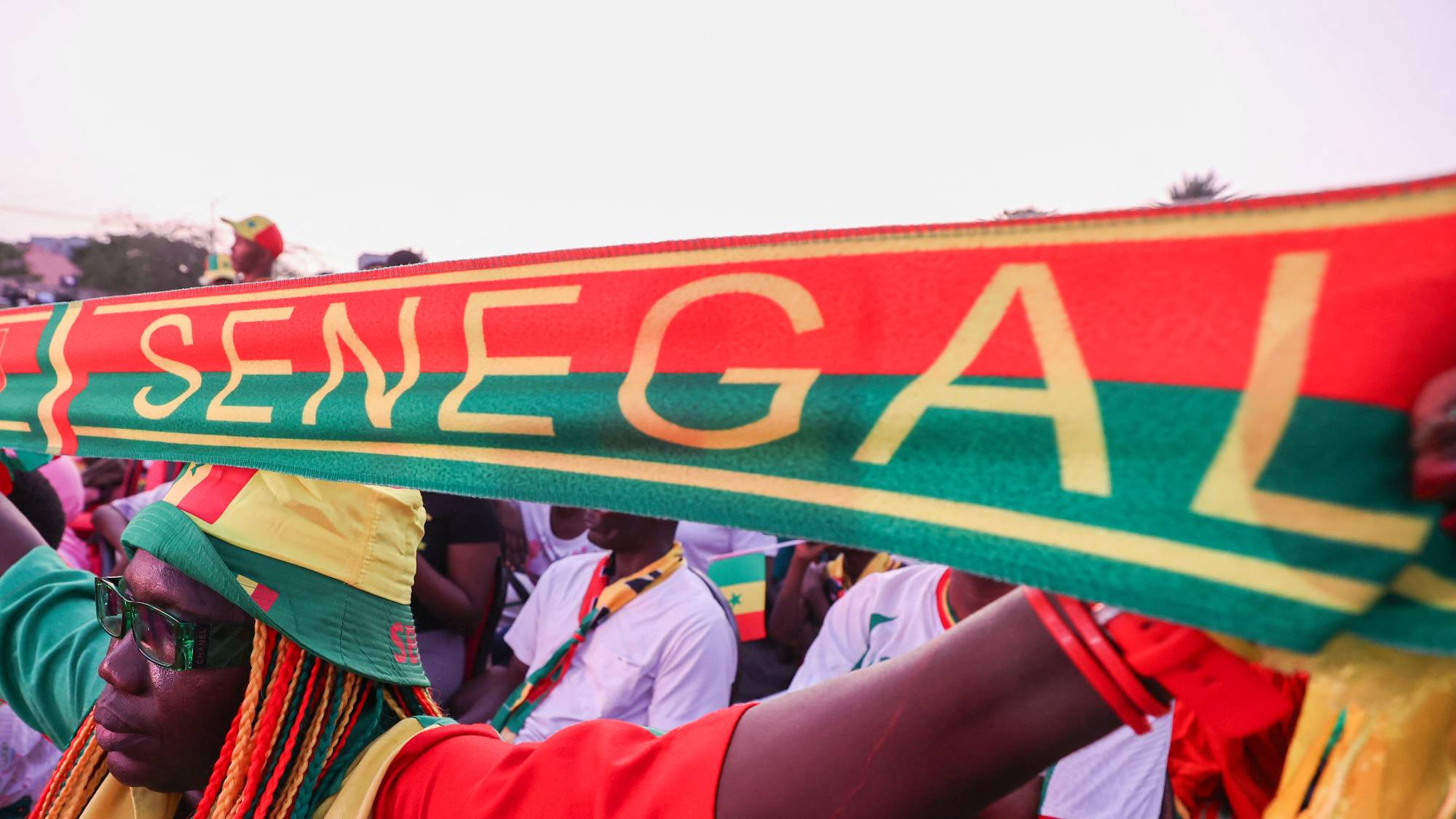 DAKAR, SENEGAL- JULY 02: Thousands of fans gather at Place de la Nation Square to watch the match on a giant screen, holding Senegal flags and wearing national team jerseys in Dakar, Senegal, on July 02, 2026. Cem Ozdel / Anadolu