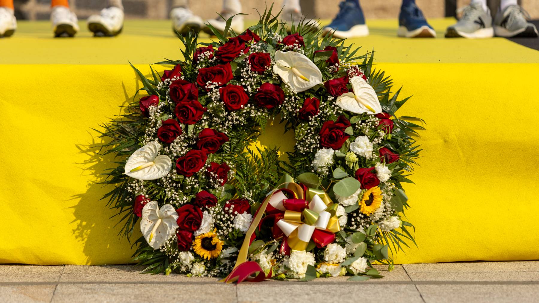 Flowers are placed in memory of Finlay Tarling of Great Britain and the NSN Cycling Team during the 9th stage from Paredes to Mondim de Basto/Sra da Graca of the Volta a Portugal 2026 in Fafe, Portugal, on August 15, 2026. (Photo by Miguel Lemos/NurPhoto)