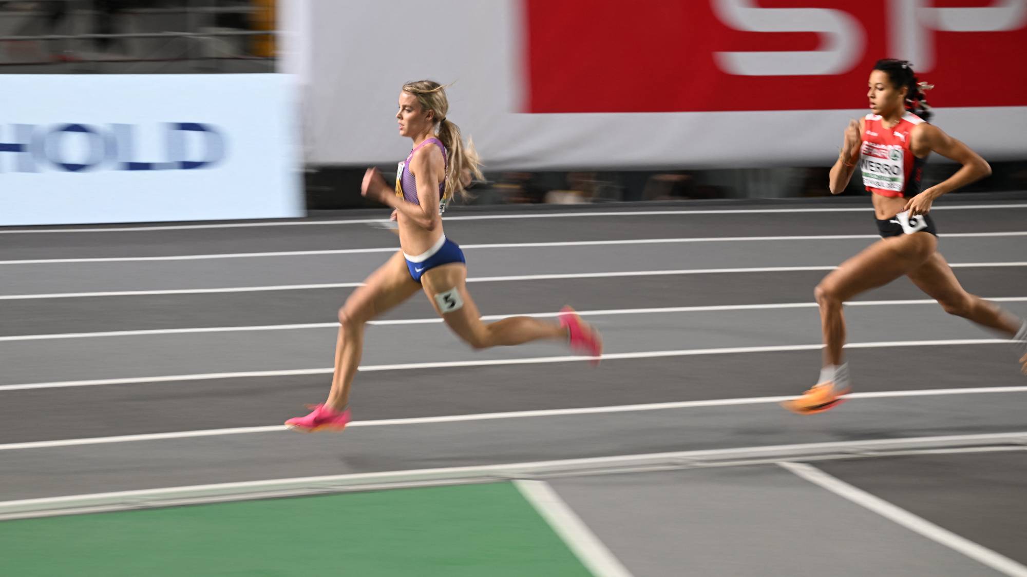 Britain's Keely Hodgkinson (L) and Switzerland's Audrey Werro compete in the semi-finals of the women's 800 metres during The European Indoor Athletics Championships at The Atakoy Athletics Arena in Istanbul on March 4, 2023.