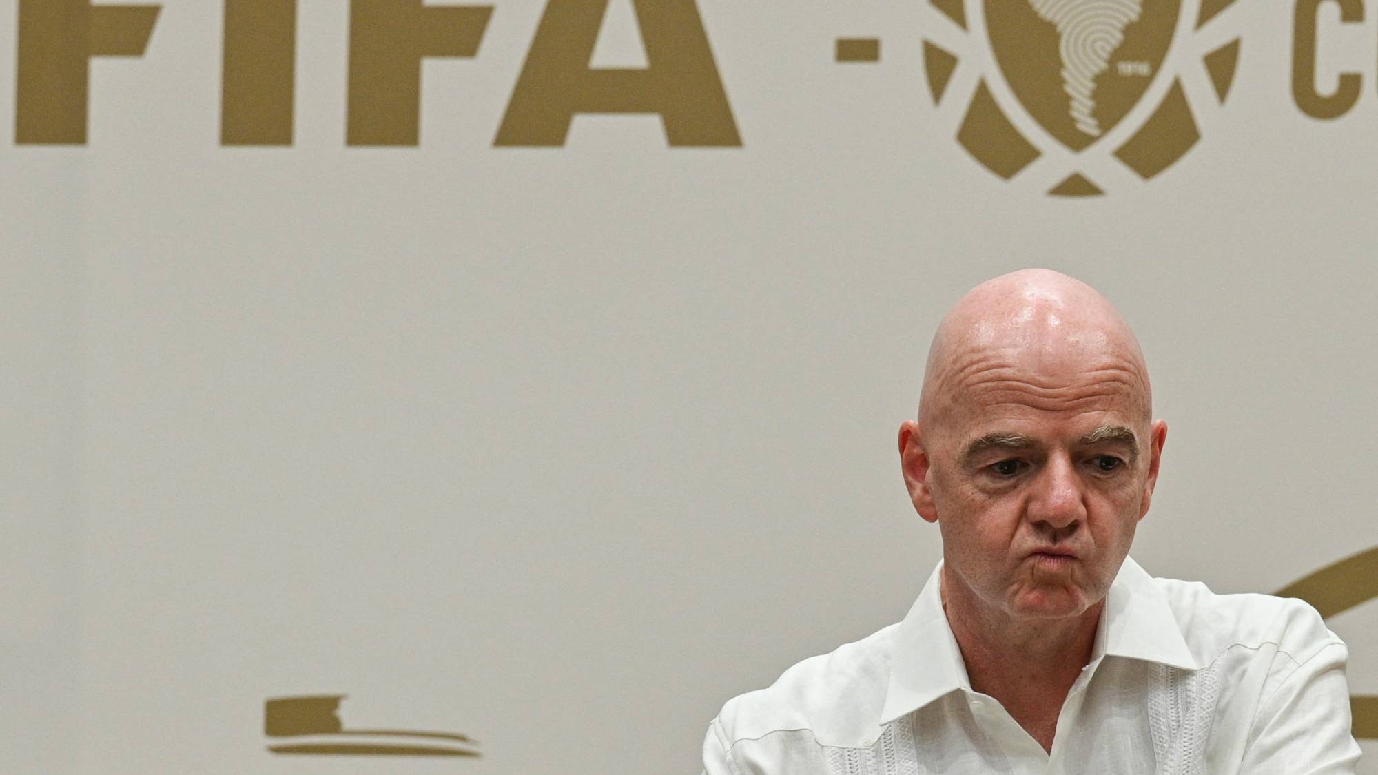 FIFA President Gianni Infantino gestures during his visit to the new Concentration Hotel of the Colombian Football Federation in Barranquilla, Colombia, on February 24, 2026. FIFA president Gianni Infantino came under renewed fire on August 10, 2026 as a joint letter from three confederations -- UEFA, CONCACAF and AFC -- declared football "belongs to no individual".