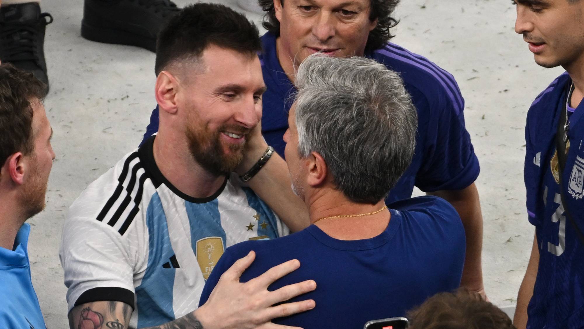 18 December 2022, Qatar, Lusail: Soccer, World Cup, Argentina - France, final round, final, Lusail Stadium, Argentina's Lionel Messi with his father Jorge Messi after the award ceremony. Photo: Robert Michael/dpa (Photo by Robert Michael/picture alliance via Getty Images)