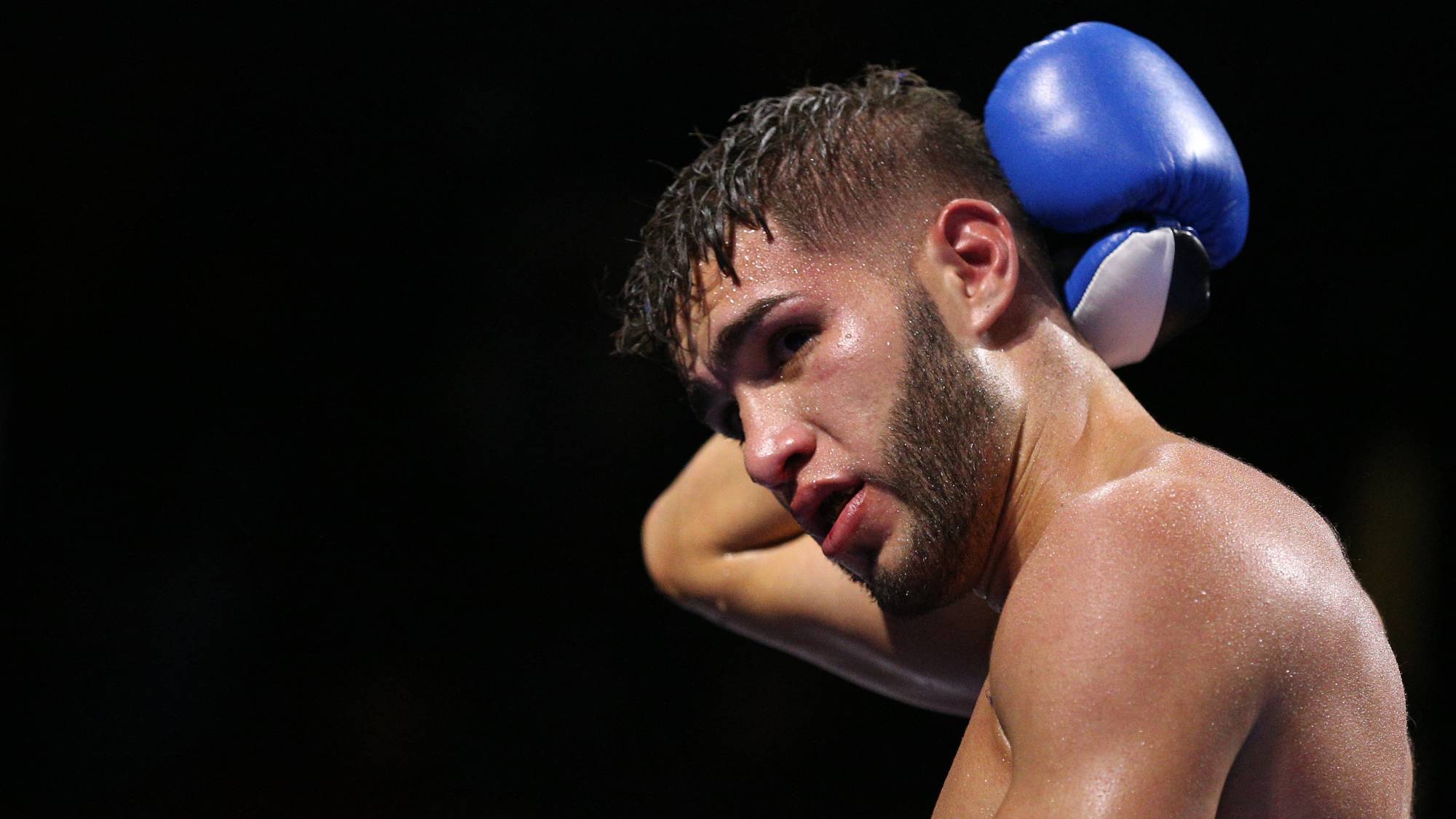 FAIRFAX, VA - OCTOBER 17: Prichard Colon holds the back of his head in a match against Terrel Williams in their super welterweights bout at EagleBank Arena on the campus of George Mason University on October 17, 2015 in Fairfax, Virginia. Patrick Smith/Getty Images/AFP