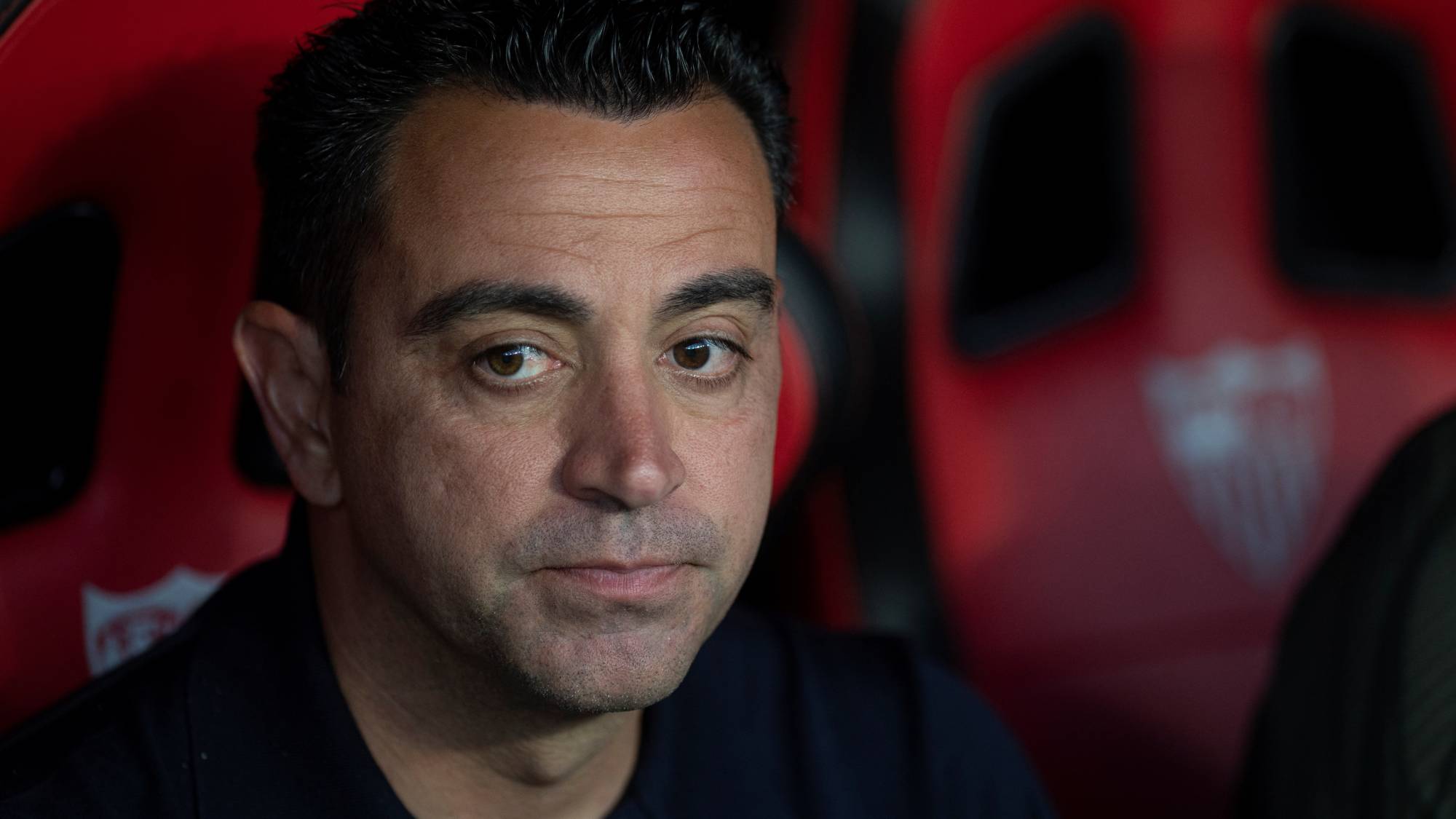 (FILES) Barcelona's Spanish coach Xavi Hernandez looks on prior to the Spanish league football match between Sevilla FC and FC Barcelona at the Ramon Sanchez Pizjuan stadium in Seville on May 26, 2024. Former Barcelona player and Spanish international Xavi Hernandez has been appointed manager of the Netherlands, succeeding Ronald Koeman, who resigned after the World Cup, the Dutch Football Association announced on August 12, 2026, via its social media channels.