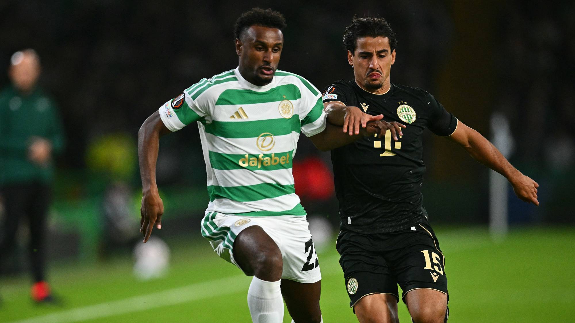 Celtic's Egyptian striker #23 Haissem Hassan (L) vies with Ferencvaros' Australian midfielder #15 Daniel Arzani during the UEFA Europa League, League phase football match between Celtic and Ferencvaros at Celtic Park in Glasgow on September 17, 2026.
