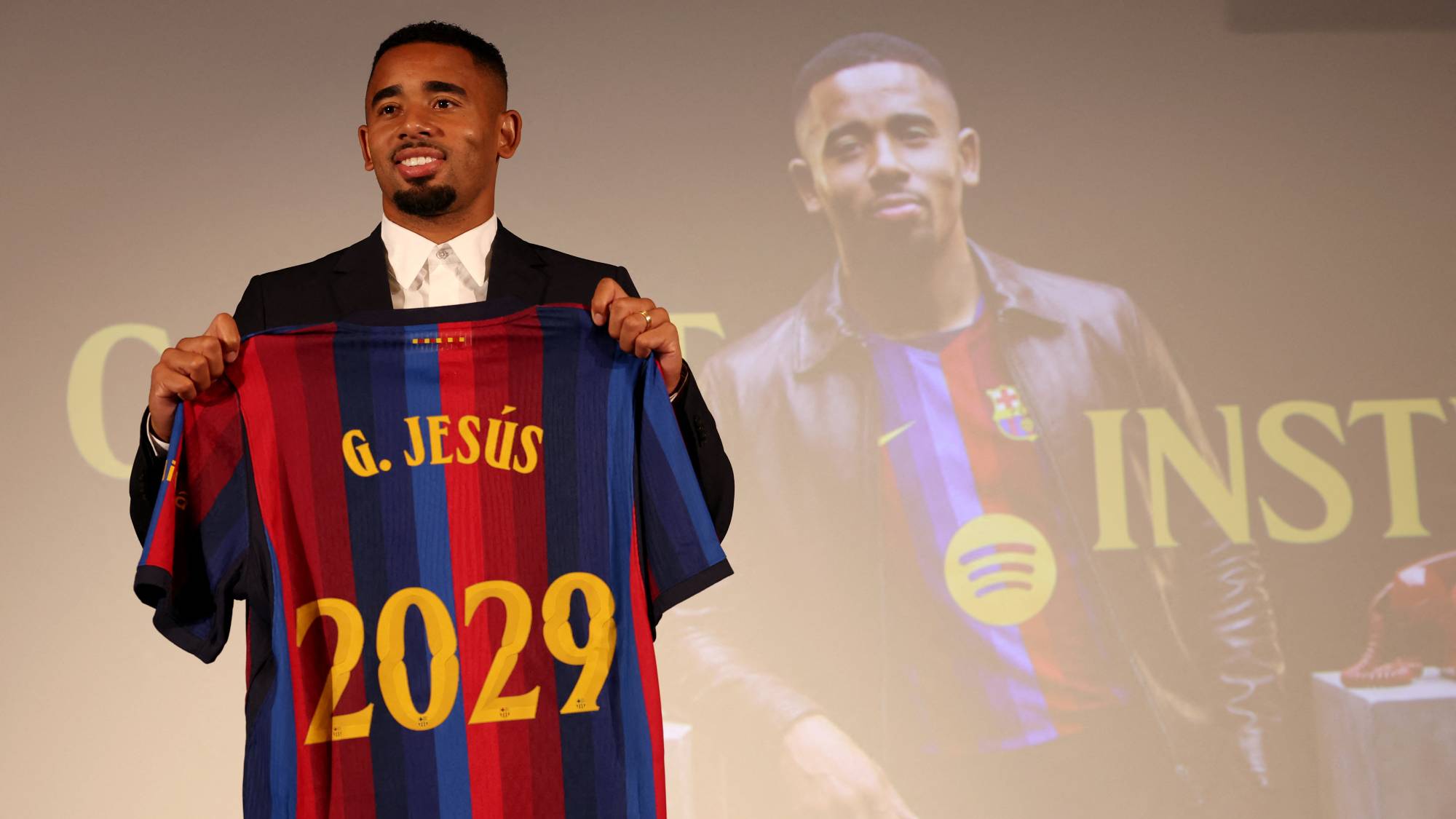Brazilian forward Gabriel Jesus poses with his jersey during his official presentation as FC Barcelona's new football player on September 1, 2026 in Barcelona. Barcelona signed Brazilian forward Gabriel Jesus from Arsenal on a deal until 2029.