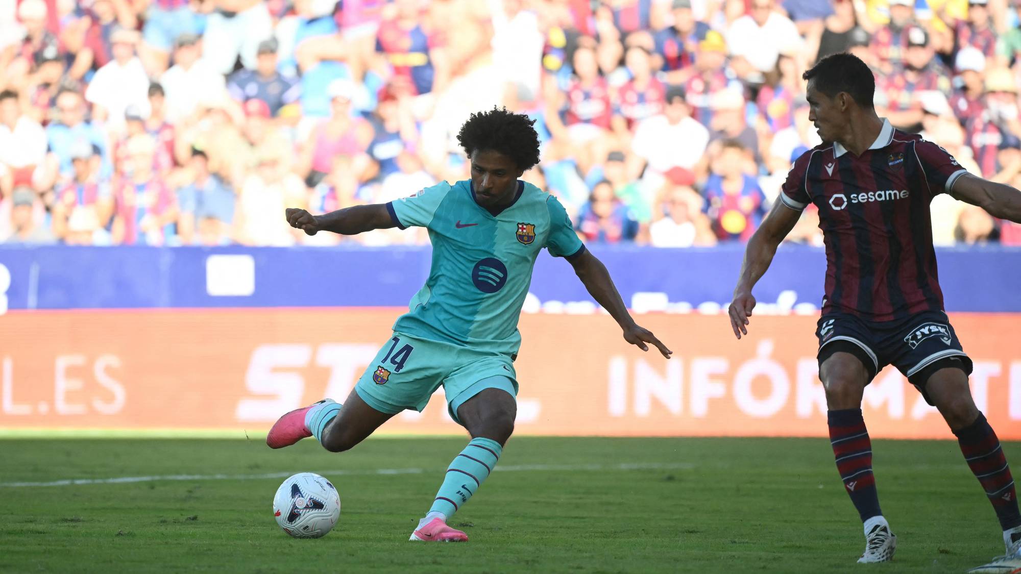Barcelona's German forward #14 Karim Adeyemi scores his team's fourth goal during the Spanish league football match between Levante UD and FC Barcelona at Ciutat de Valencia Stadium in Valencia on September 13, 2026.